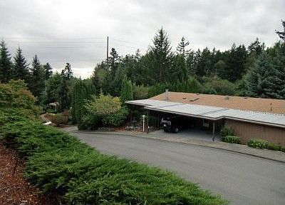 Situated on a corner lot and above the street providing an open view!