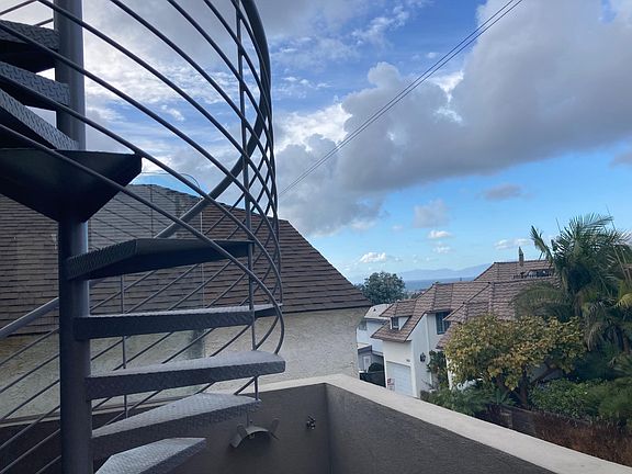 Roof Deck: Spiral Stairs to 400 sq ft Ocean View deck. Lower Deck outside Master Bedroom has an ocean view.