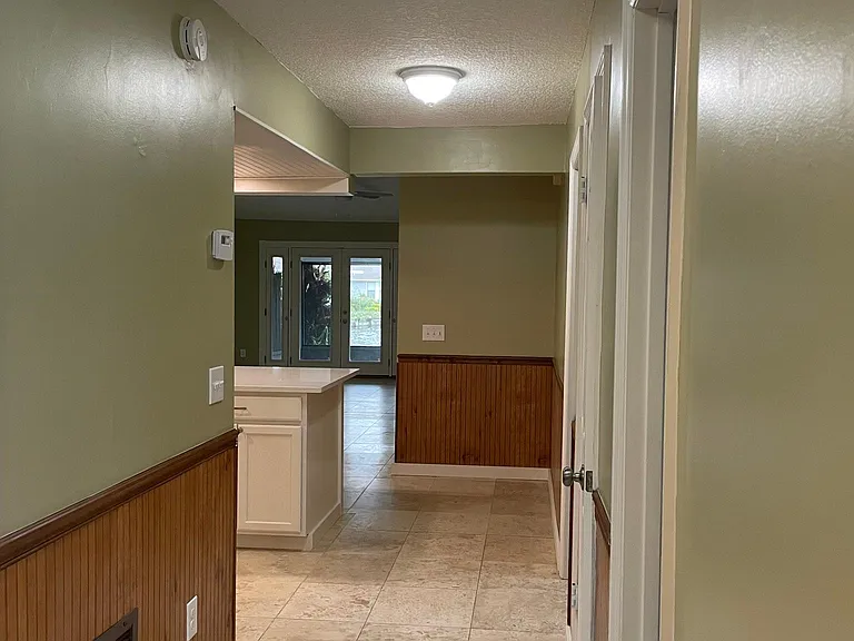 Front entryway -Skylight for natural lighting- view all the way to the water nearly from the front door.