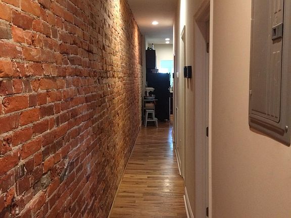 Hallway with exposed brick
