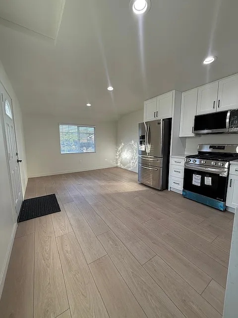 Kitchen open to the livingroom - 17228 E Millburgh Rd