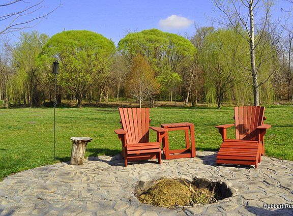 with a park-like backyard.