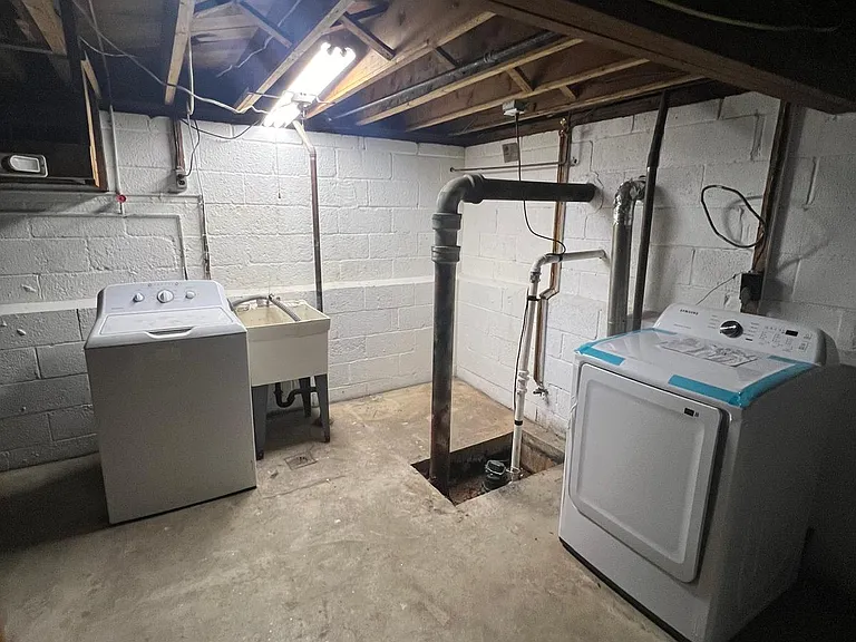 washer and dryer in basement