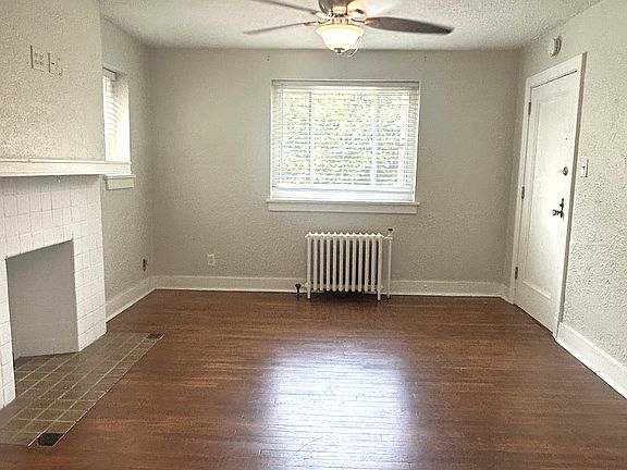Living Room 
Apartment door entrance
Hardwood floors 
New Windows