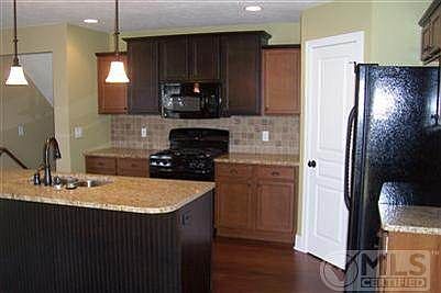 Convenient Kitchen with Pantry and granite countertops - another home, same floor plan. appliances do not come with home