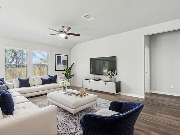 Virtually staged living room in Preston floorplan at a Meritage Homes community.