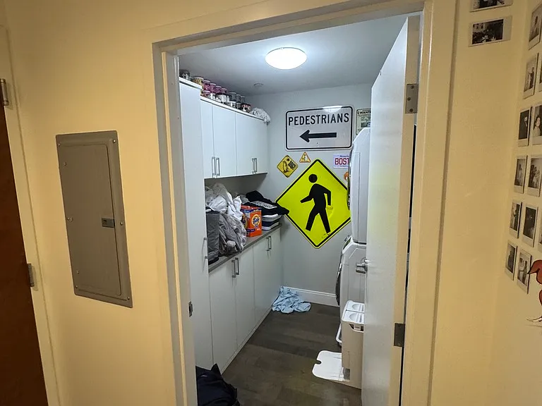 In unit laundry room. Was in use, apologies for shirt on ground/blankets.