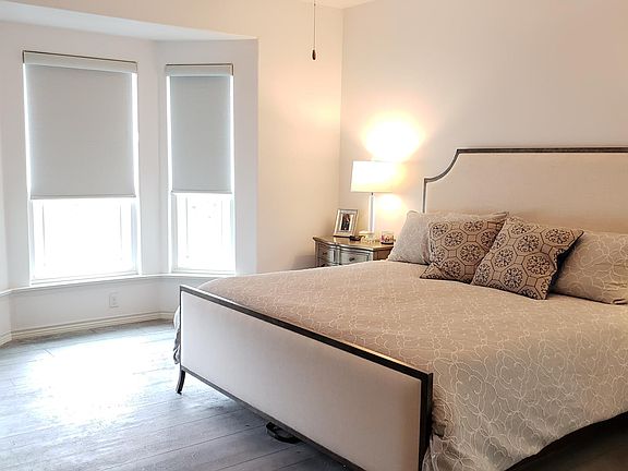 Master Bedroom w/ custom shades and reading nook