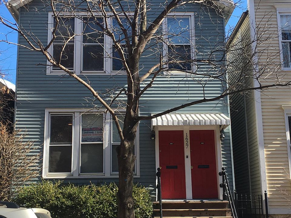 Street view of 1627 N. Hudson, locked gate on side leads to 