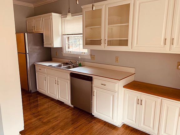Kitchen with pantry and stainless steel appliances.