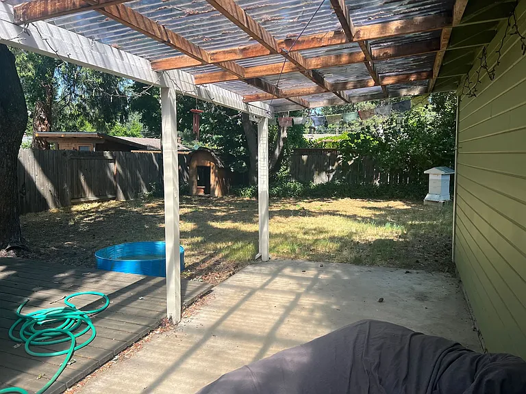 covered patio and back yard