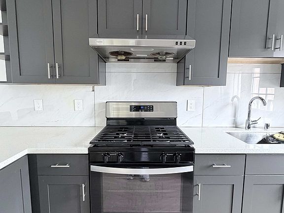 Kitchen with full stove/oven, fridge, & dishwasher