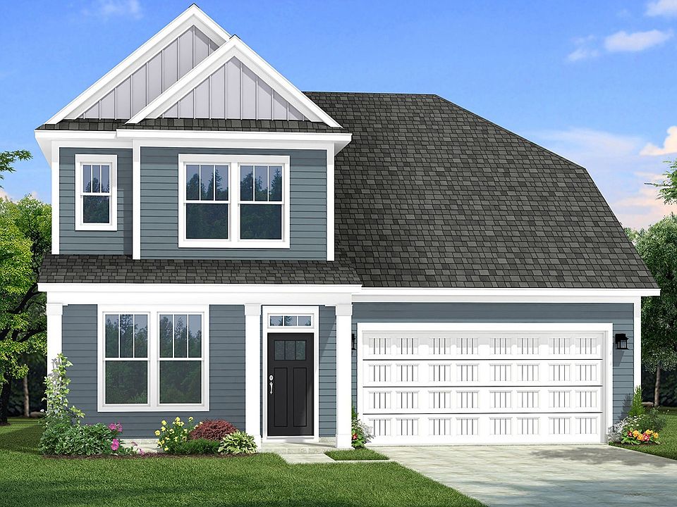 Two-story single family home with blue siding, a covered front porch and 2 car garage.