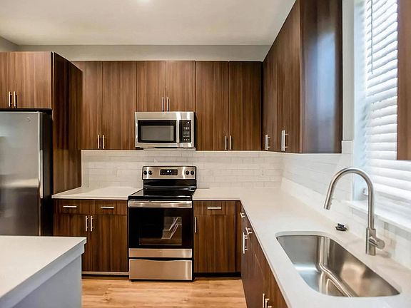 Sleek Kitchen Finishes with Subway Tile Backsplash