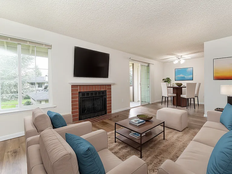 Experience elegance in this spacious living area, featuring plush seating and a warm fireplace. Experience elegance in this spacious living area, featuring plush seating and a warm fireplace.