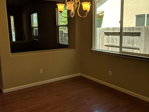 Laminate Flooring in Family, Dining, and Kitchenn