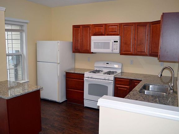 Remodeled kitchen with new cabinets and granite countertops