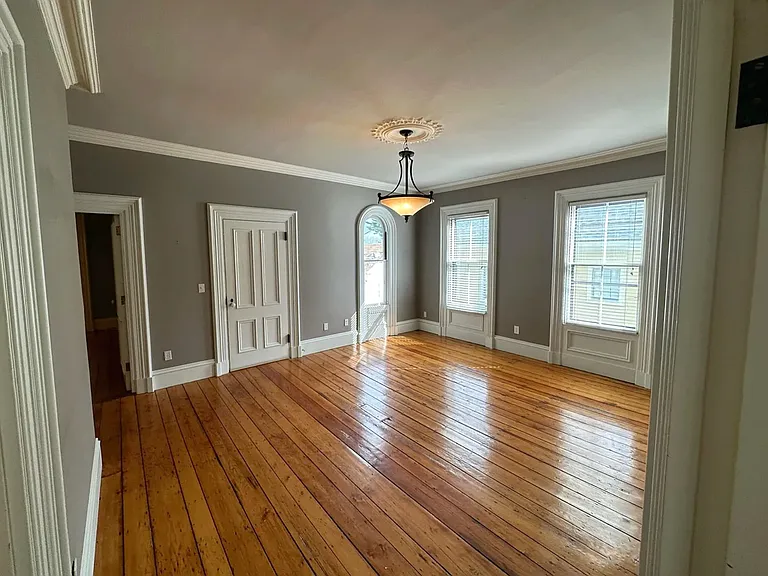 Living room with view of front entry door