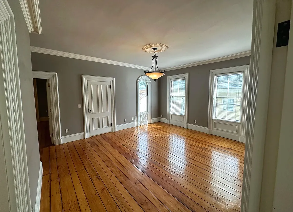 Living room with view of front entry door - 150 Carpenter St #2