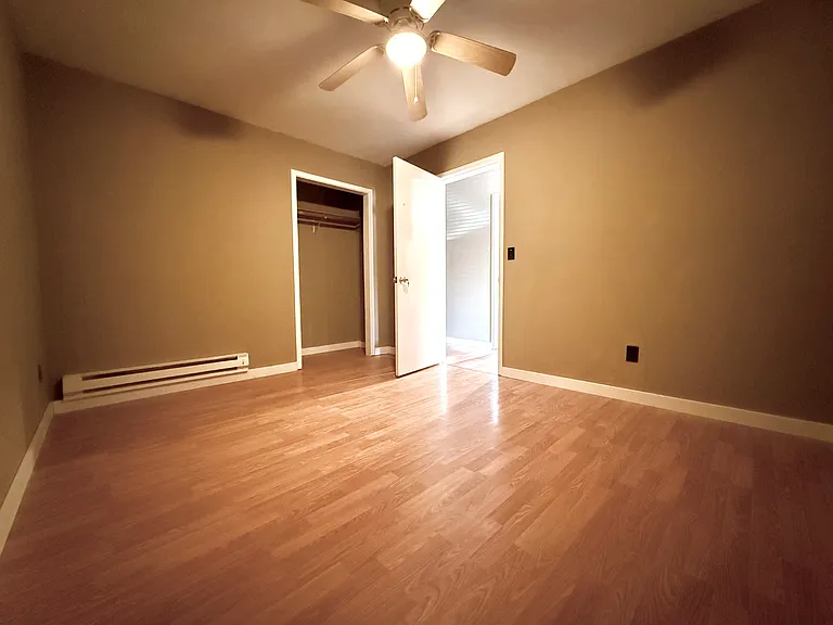 First Bedroom with fan and closet