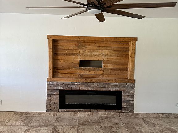 Great room, entertainment center & electric fireplace.