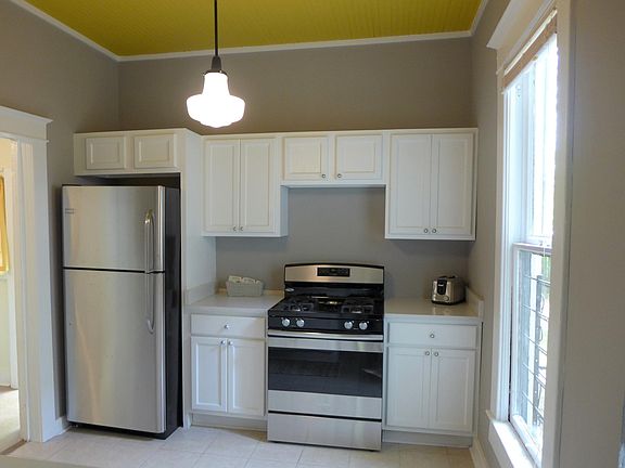 Kitchen complete with stainless steel appliances, dishes, po