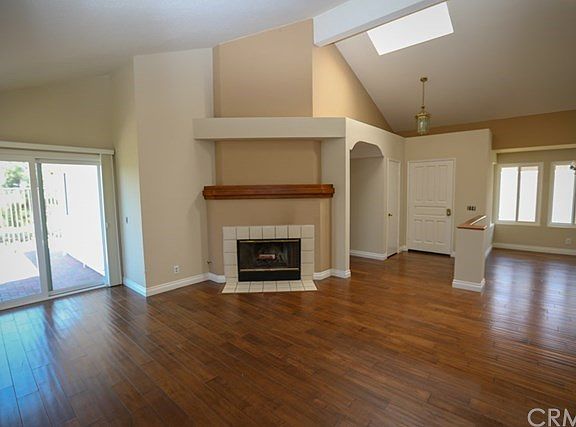 Living room with fireplace, sliding glass doors to back patio area
