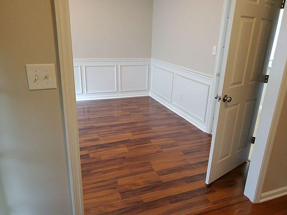 Formal Dining room with access to the kitchen. Perfect for the holidays.