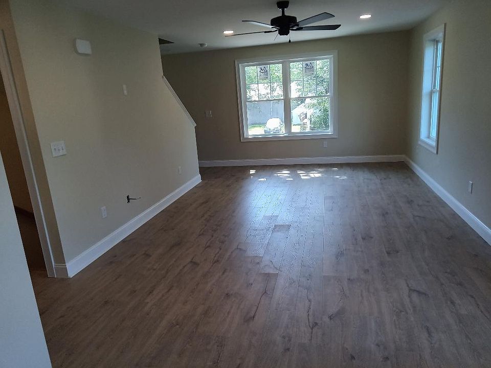 living room to stairway to bedrooms up stairs.