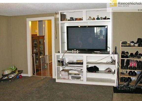 Front room with built in entertainment center.