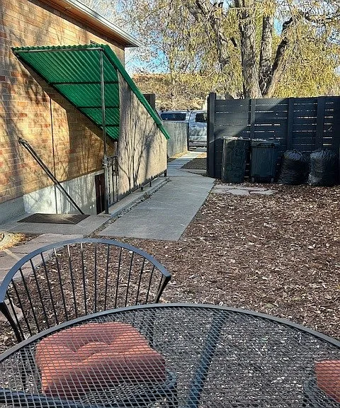 View from far corner to front yard, private stairs to unit.