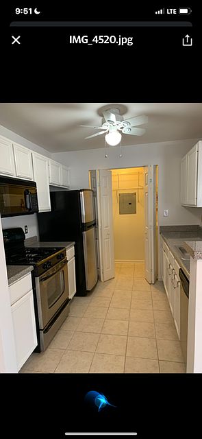 KITCHEN with granite counter tops and built-in microwave