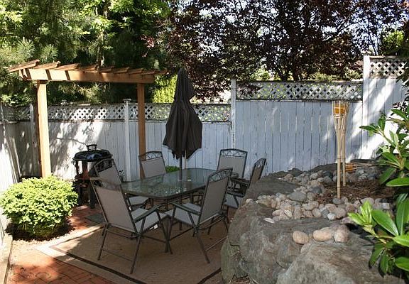 Private patio area in backyard