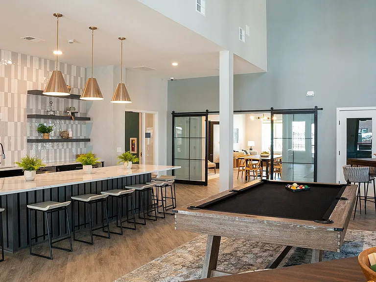 The Nese clubhouse includes a game room with billiards and kitchen.