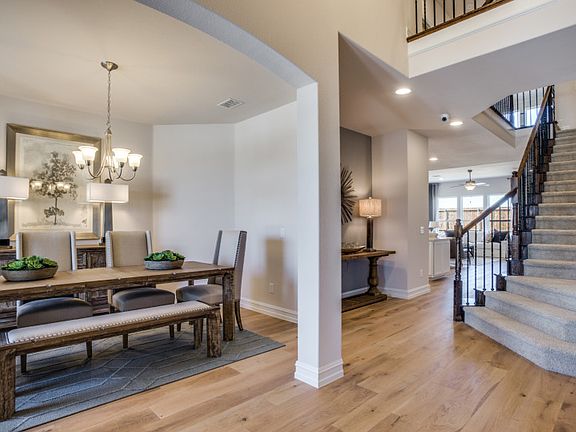 Model Representation - Formal dining and view of staircase at entry