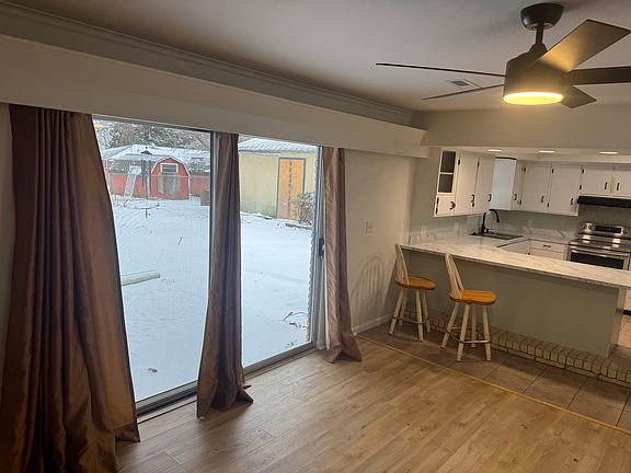 Den/Kitchen. Sliding glass doors to backyard.