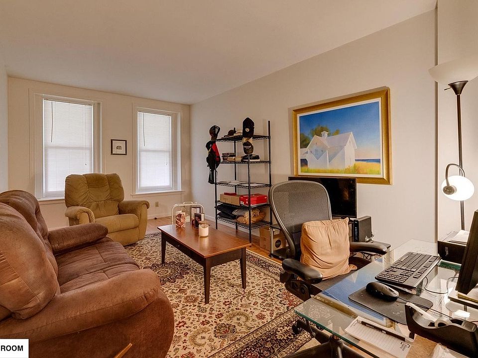 Living Room with large couches and furniture for scale.