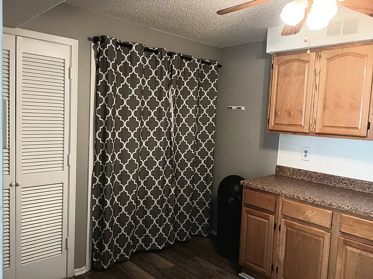 Kitchen 2 with Washer/Dryer hookups behind curtains