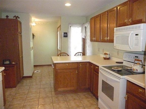 Kitchen with Snack Bar and Tile Floors