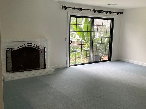 Fireplace in LR and slider to exterior backyard