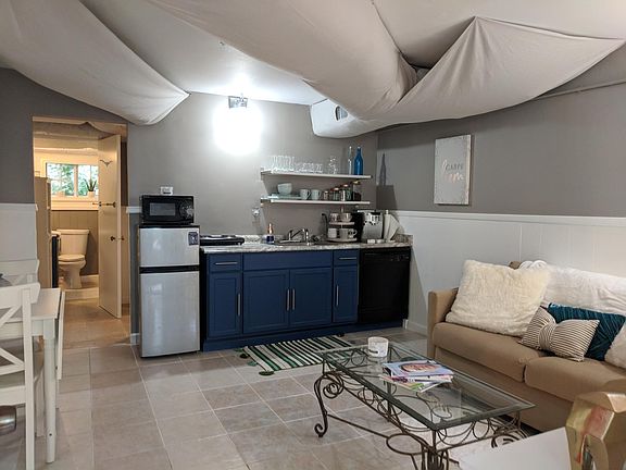 View from entry into kitchen and living space with current t