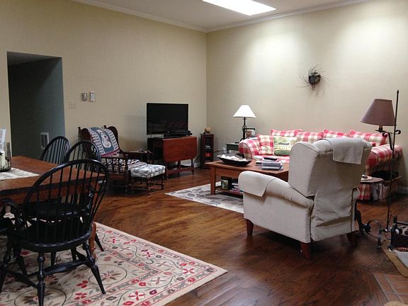 Living room with vaulted ceilings and skylights