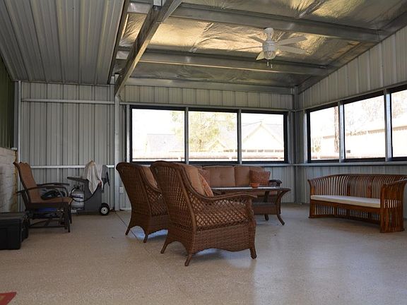 Large sun porch at the front of home. Perfect place to relax and enjoy a good book,