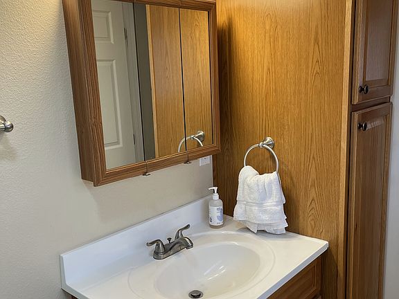 Linen closet located inside bathroom