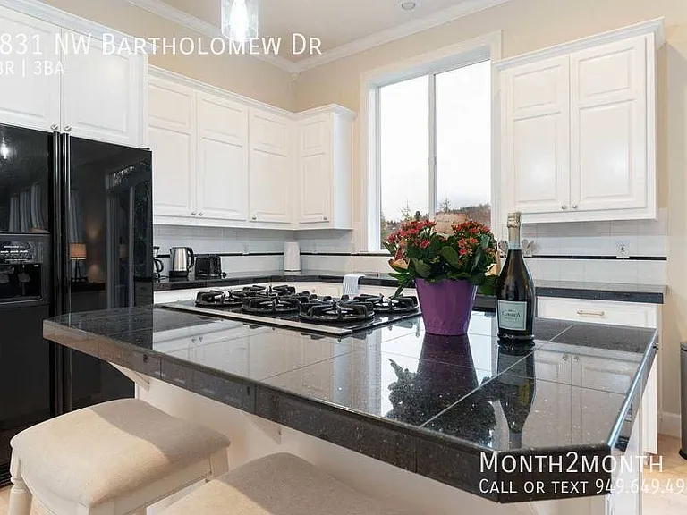 9831 NW Bartholomew Dr — Photo 9