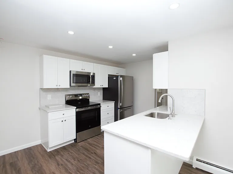 Kitchen with brand new appliances, countertops, cabinets and backsplash