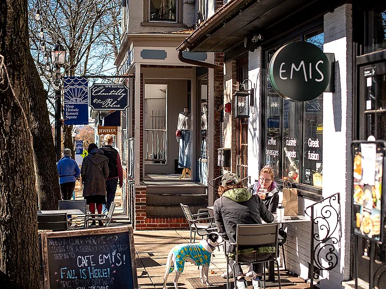 Experience the vibrant atmosphere of a quaint downtown cafe.