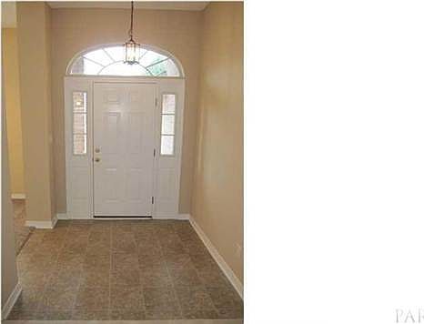 View of the foyer from the great room. Office to your left.