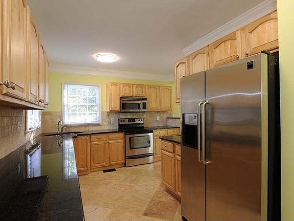 Kitchen has granite and SS appliance