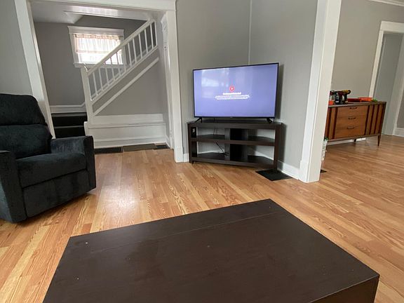 Flat screen tv, coffee table with storage, couch, and recliner included. Space for a second couch to be added if desired (not included).